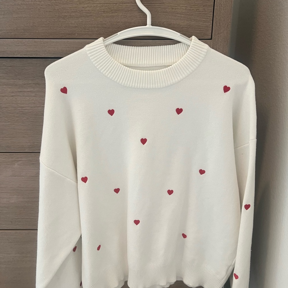 White Sweater with Red Heart Accents